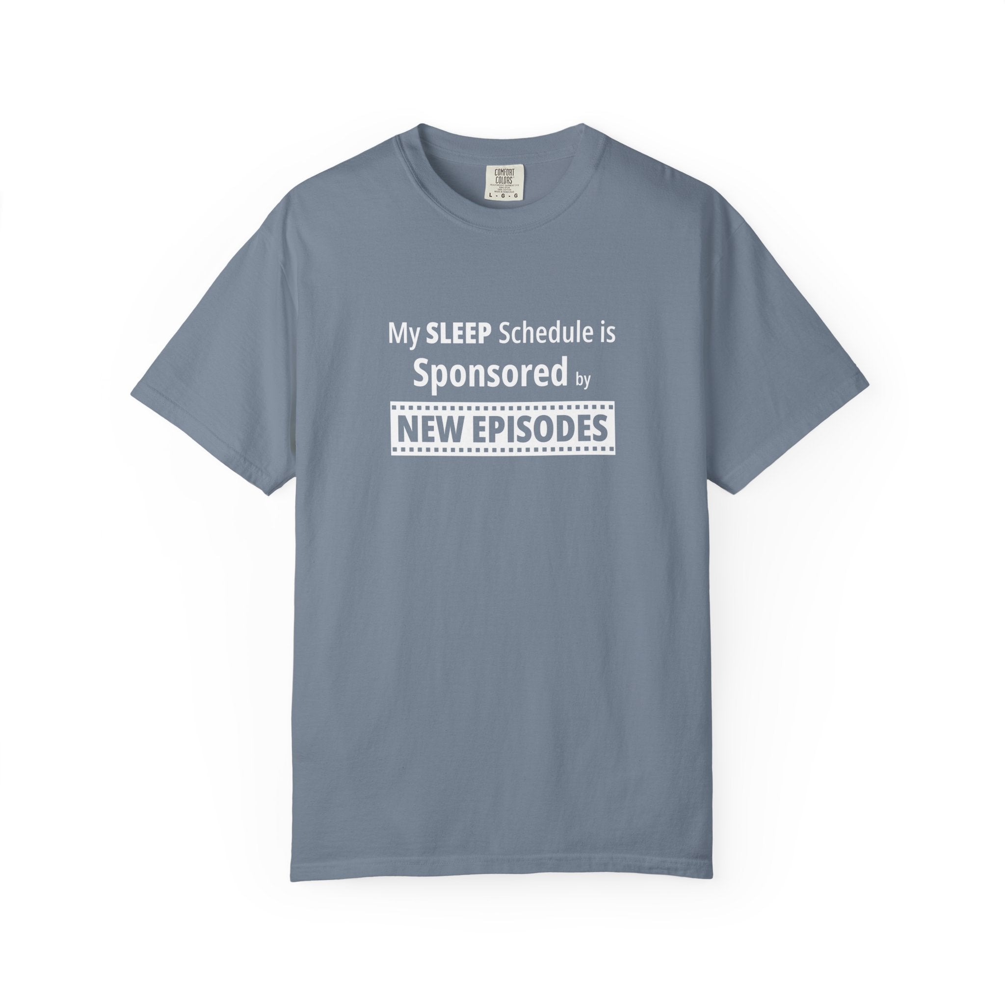Gray t-shirt with humorous, funny, witty 'My Sleep Schedule is Sponsored by New Episodes' text design on a white background