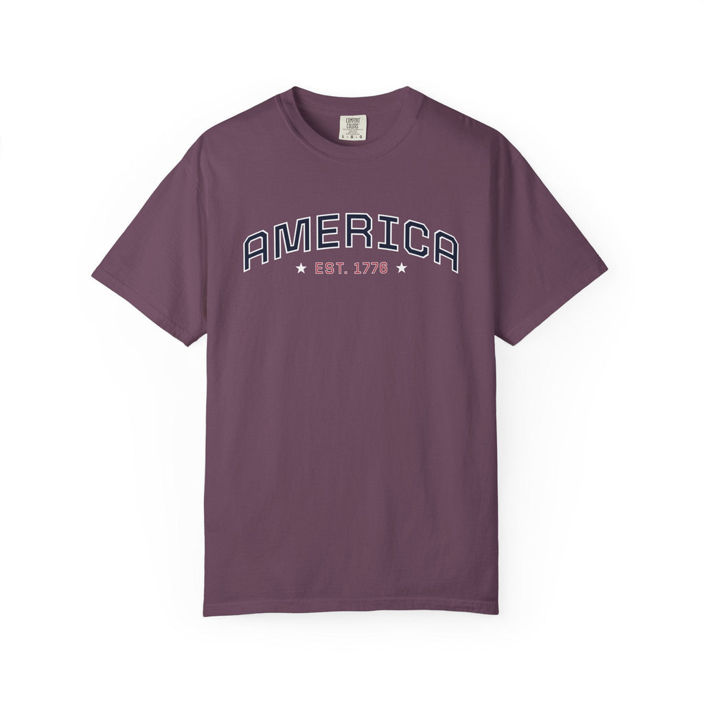 Berry t-shirt with 'AMERICA EST. 1776' typography design in varsity style on a white background