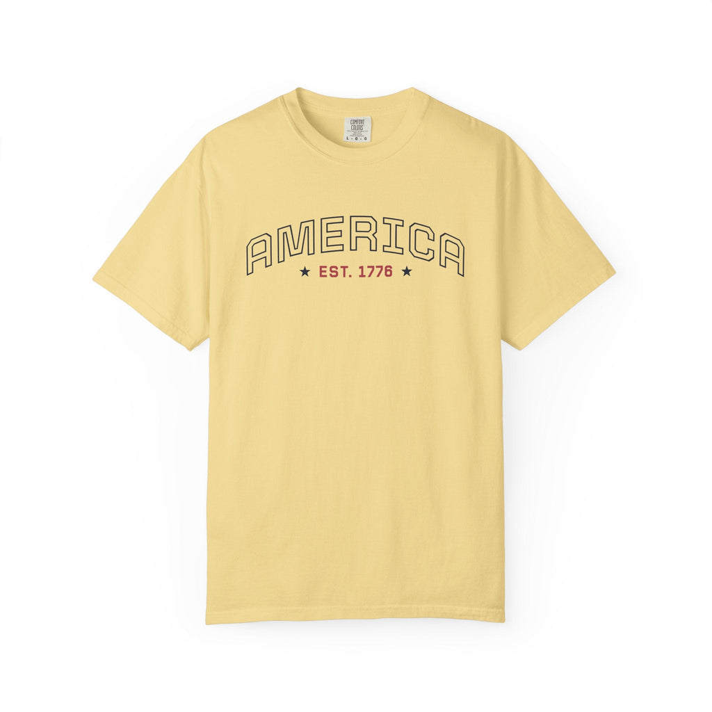 Butter t-shirt with 'AMERICA EST. 1776' typography design in varsity style on a white background