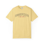 Butter t-shirt with 'AMERICA EST. 1776' typography design in varsity style on a white background