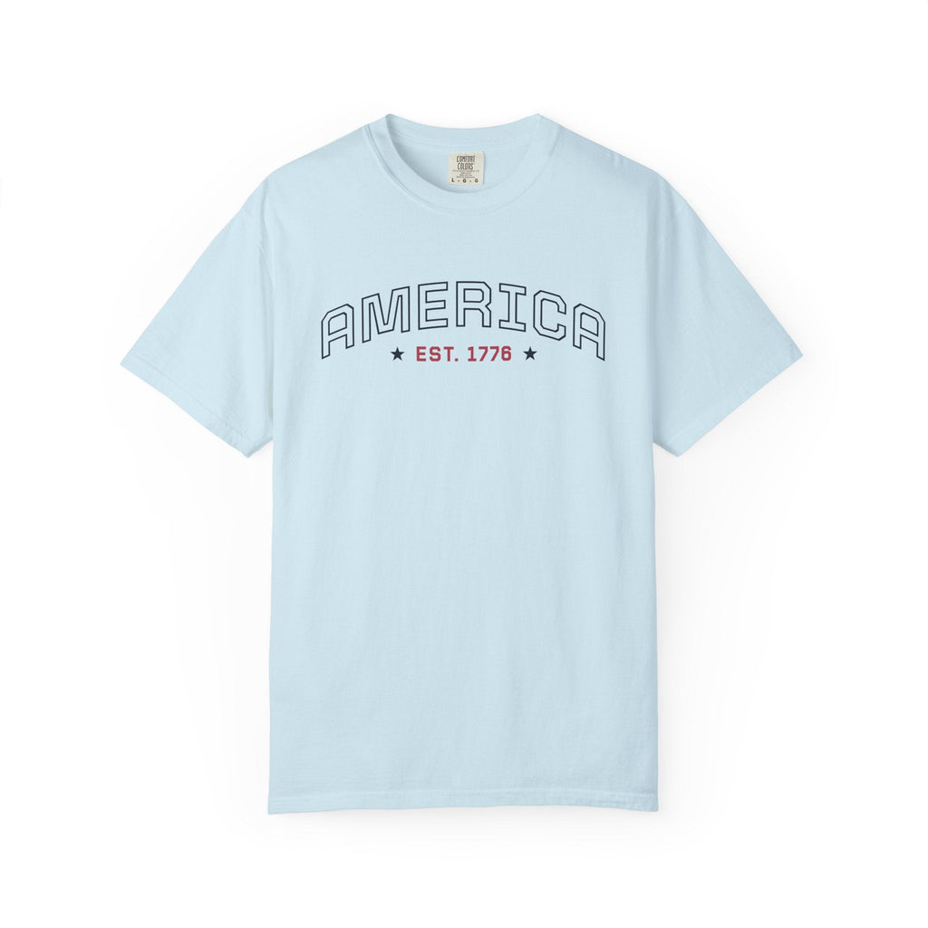 Chambray t-shirt with 'AMERICA EST. 1776' typography design in varsity style on a white background