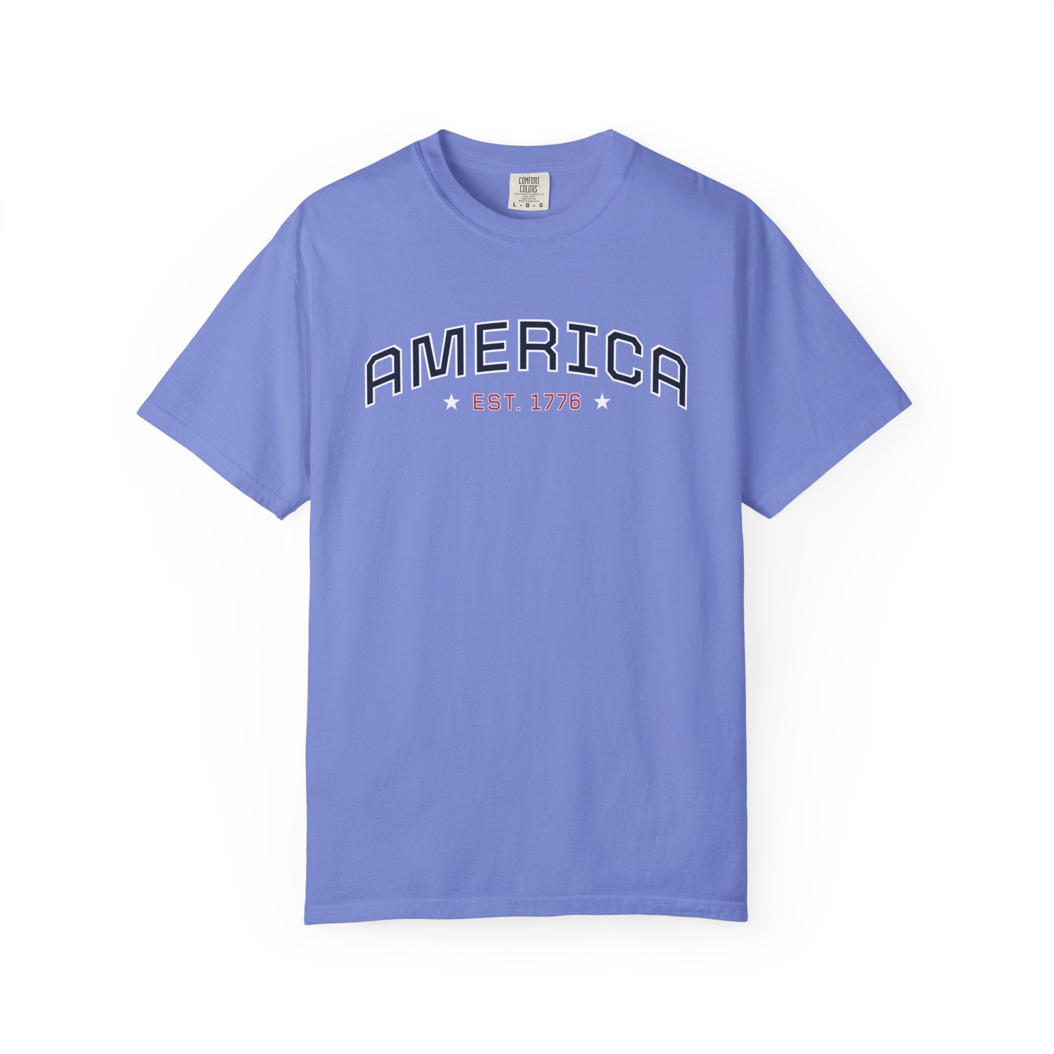 Flo Blue t-shirt with 'AMERICA EST. 1776' typography design in varsity style on a white background