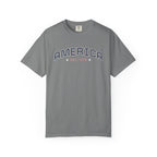 Grey t-shirt with 'AMERICA EST. 1776' typography design in varsity style on a white background
