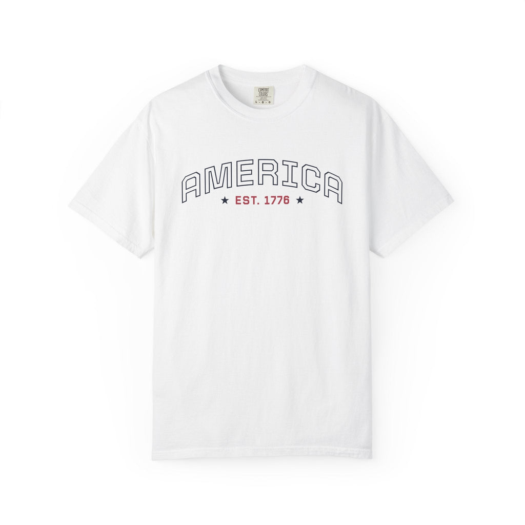 White t-shirt with 'AMERICA EST. 1776' typography design in varsity style on a white background