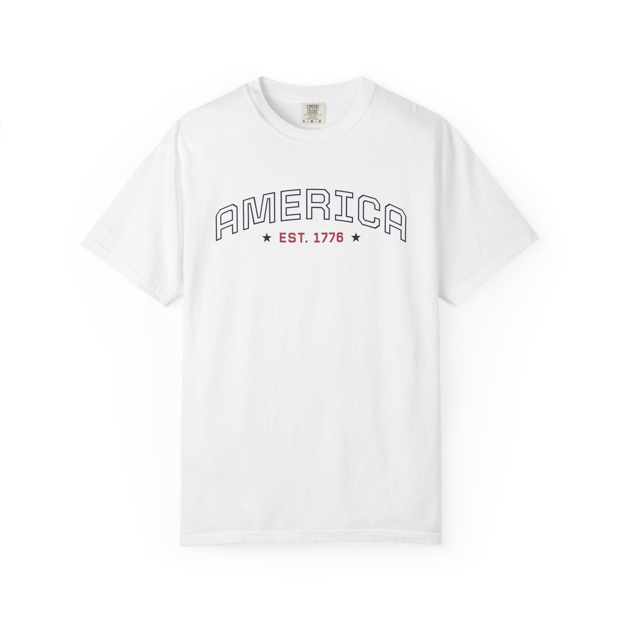 White t-shirt with 'AMERICA EST. 1776' typography design in varsity style on a white background