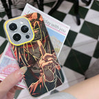 Phone case with anime Naruto Shippuden Uchiha Itachi artistic design held by a person on a checkered floor.