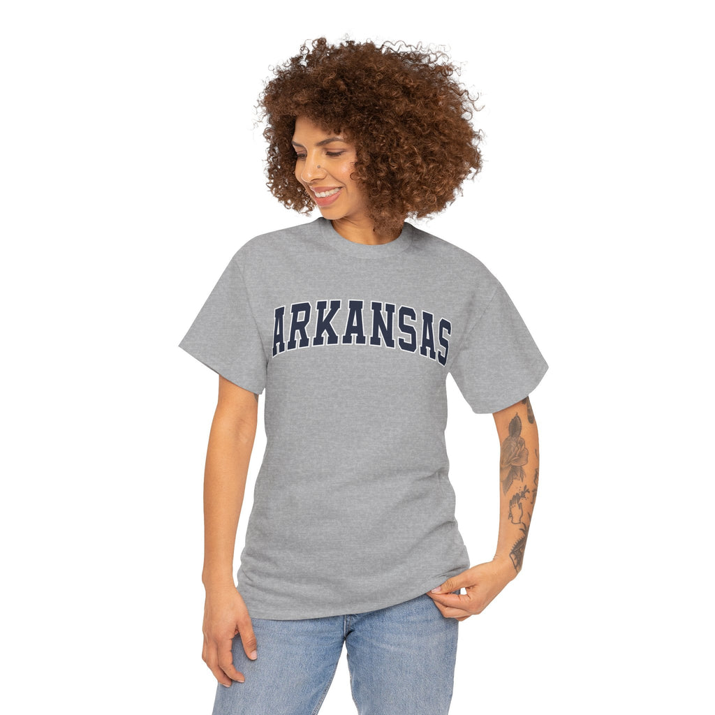 Woman wearing a gray 'ARKANSAS' t-shirt on a white background