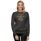 Woman wearing a dark gray sweatshirt with yellow witty otaku anime text on a white background