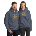 Two people wearing matching blue hoodies with humorous 'I'm Not Ignoring You, I'm Reading the New Chapter' text on a white background