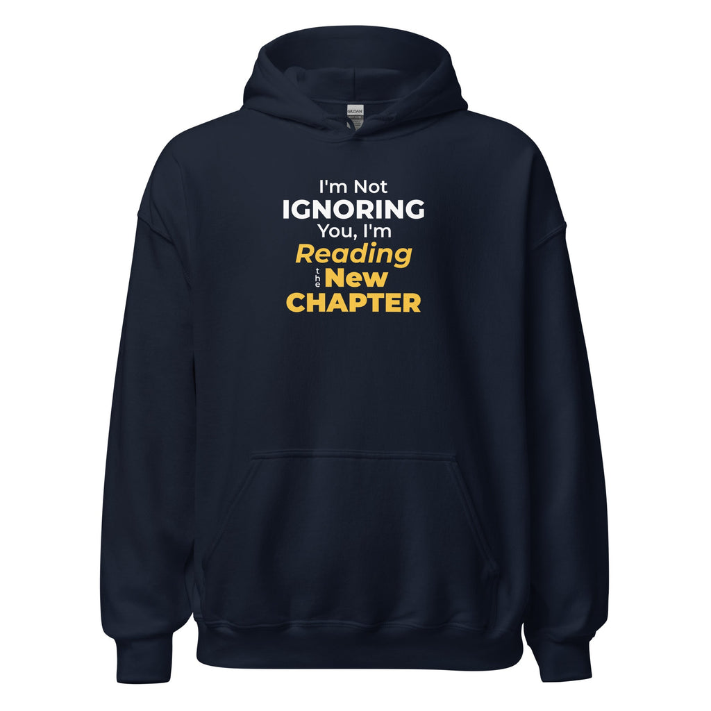 Navy blue hoodie with humorous 'I'm Not Ignoring You, I'm Reading the New Chapter' text design on a white background