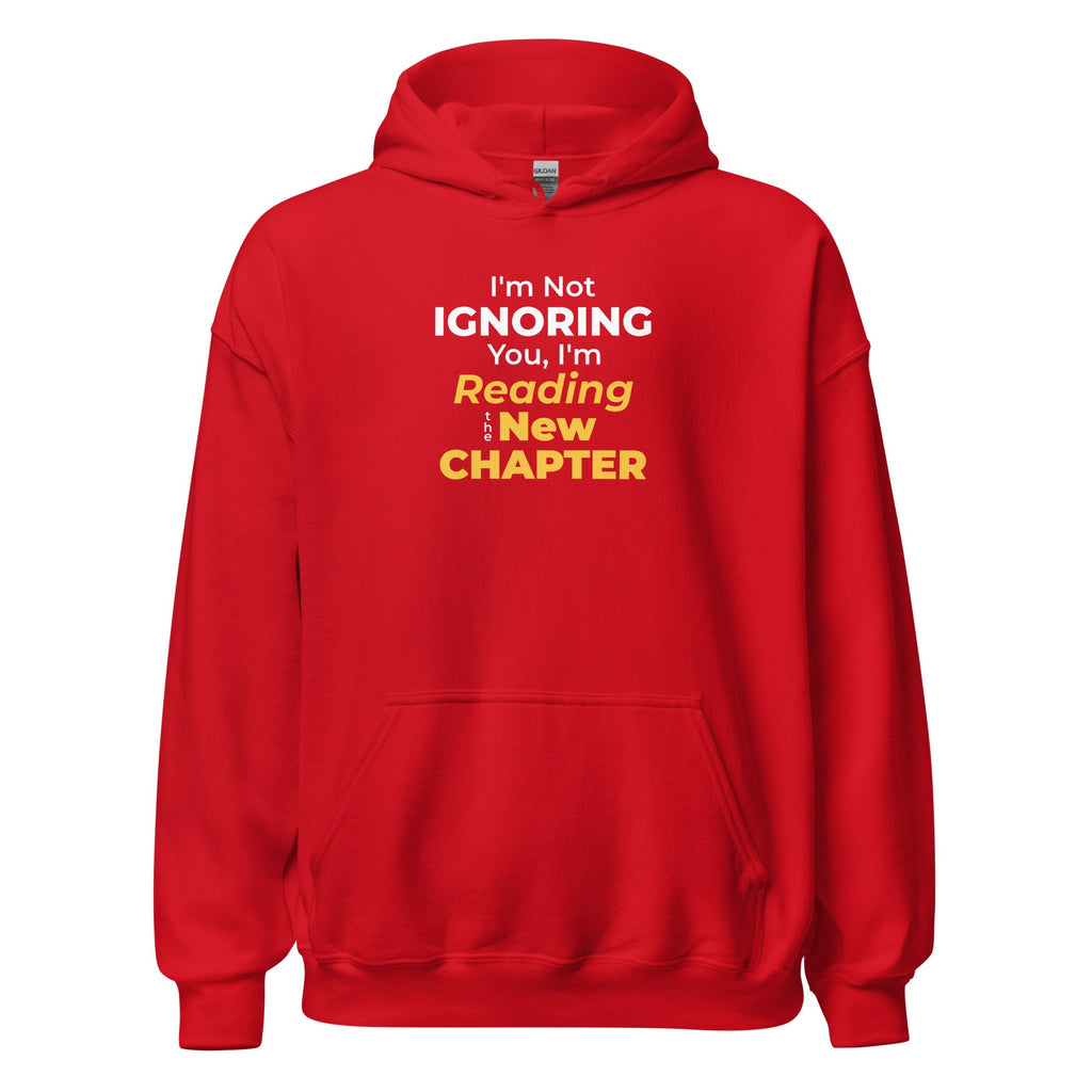 Red hoodie with funny otaku manga text 'I'm Not Ignoring You, I'm Reading the New Chapter' on a white background