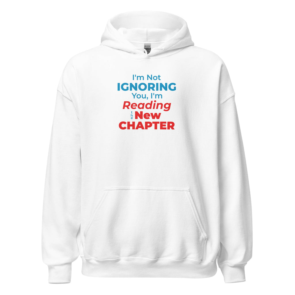 White hoodie with text 'I'm Not Ignoring You, I'm Reading a New Chapter' on a white background