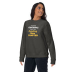 Person wearing a dark gray sweatshirt with humorous, witty manhwa reader text design on a white background