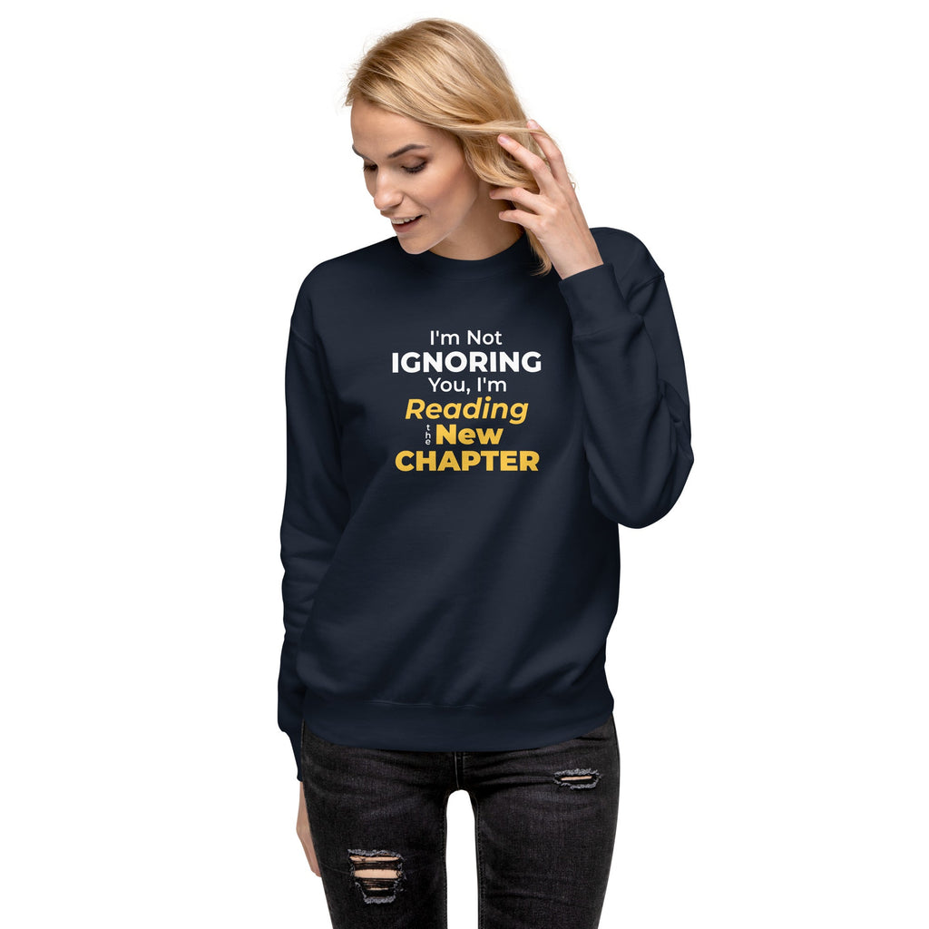 Person wearing a navy blue sweatshirt with humorous, witty manhwa reader text design on a white background