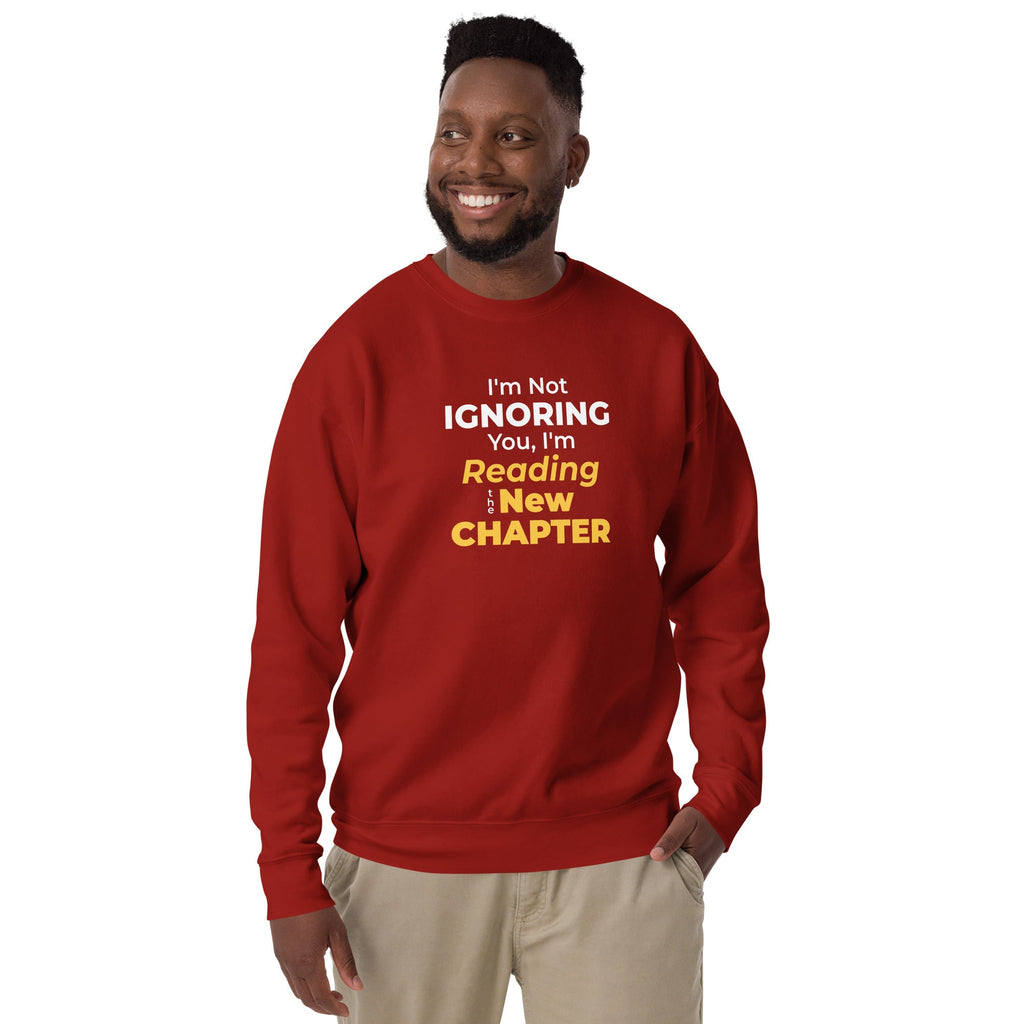 Man wearing a red sweatshirt with a witty manhwa reader quote on a white background