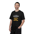 A men wearing Black t-shirt with text 'I'm Not Ignoring You, I'm Reading the New Chapter' on a white background