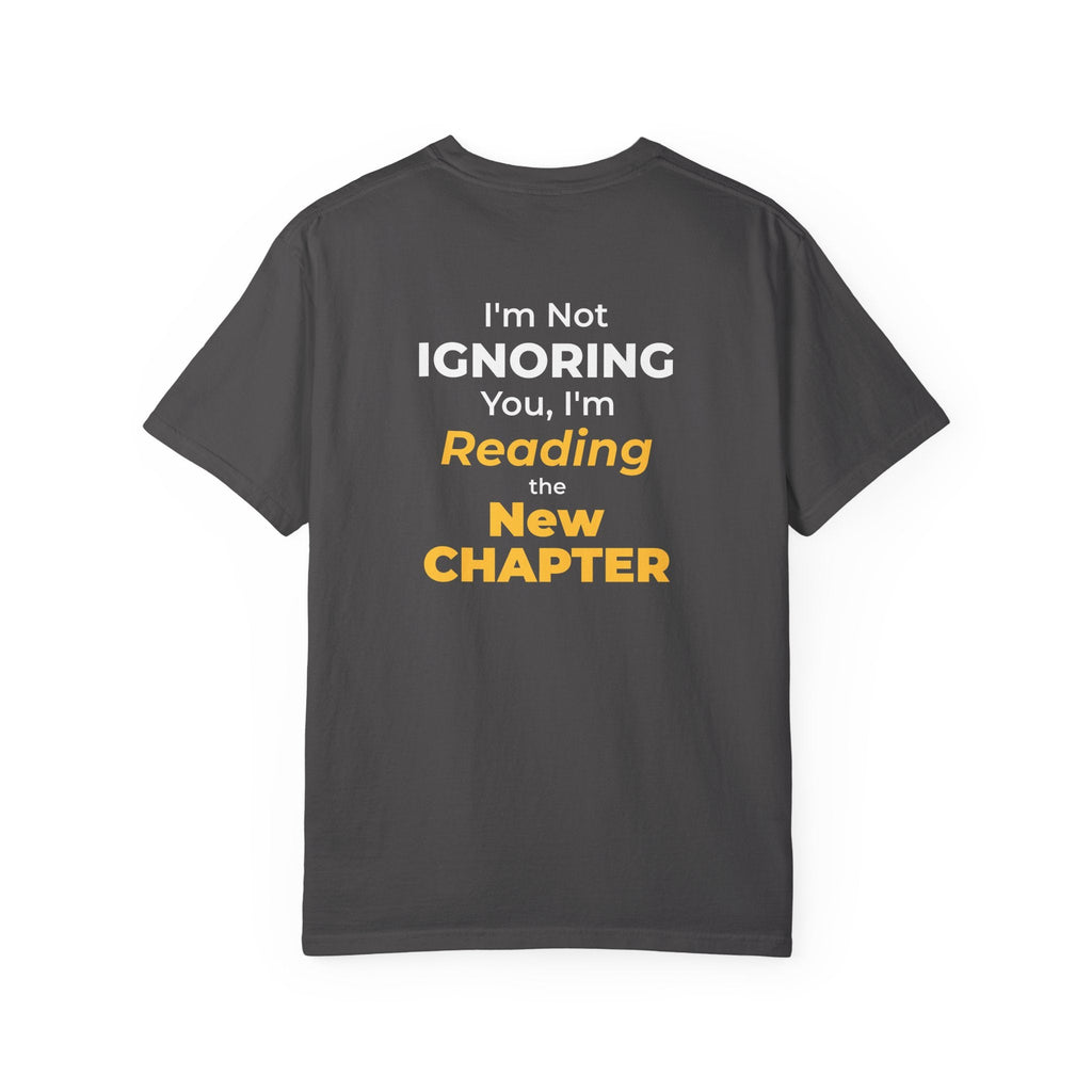 Graphite t-shirt with text 'I'm Not Ignoring You, I'm Reading the New Chapter' on the back side on a white background