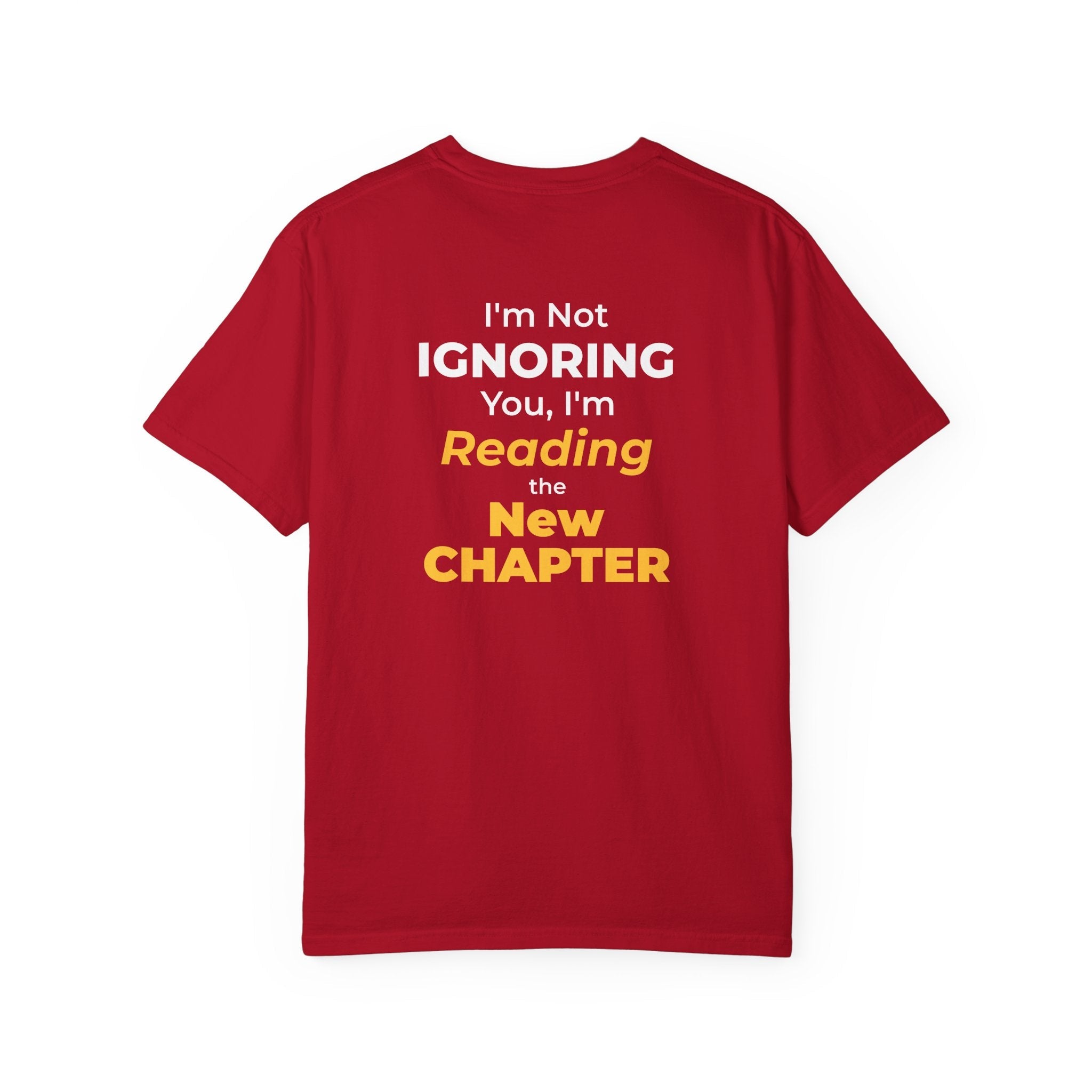 Red t-shirt with text 'I'm Not Ignoring You, I'm Reading the New Chapter' on the back side on a white background