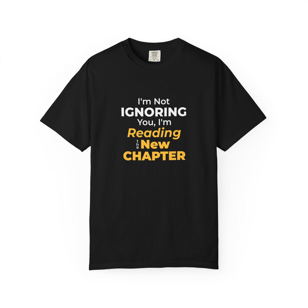 Black t-shirt with text 'I'm Not Ignoring You, I'm Reading the New Chapter' on a white background