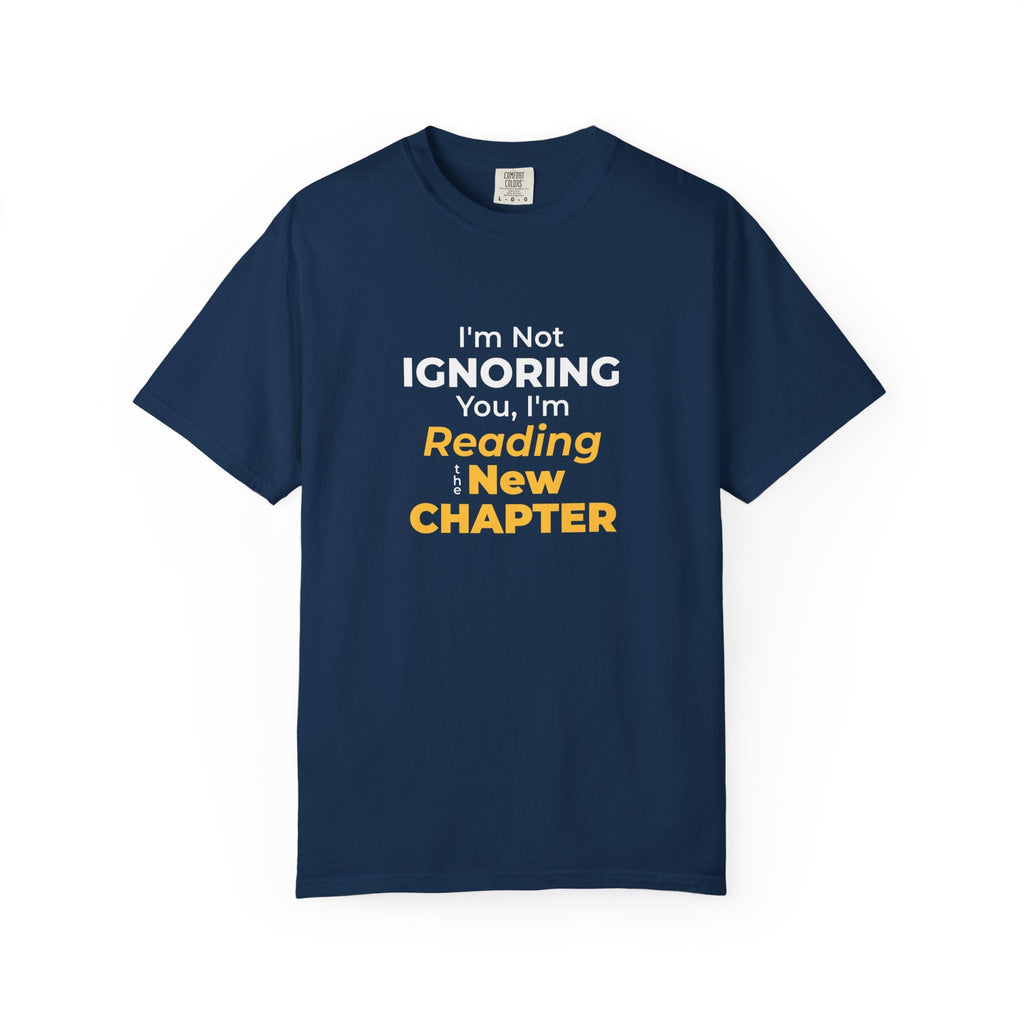Navy t-shirt with text 'I'm Not Ignoring You, I'm Reading the New Chapter' on a white background
