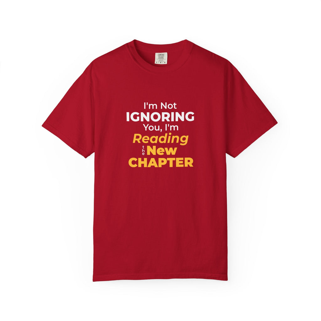 Red t-shirt with text 'I'm Not Ignoring You, I'm Reading the New Chapter' on a white background