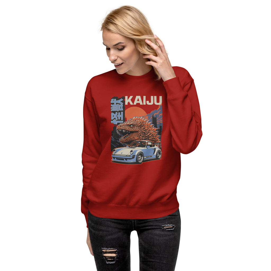a woman wearing a cardinal red sweatshirt with a monster kaiju and Porsche Car vintage Graphic design against a white background