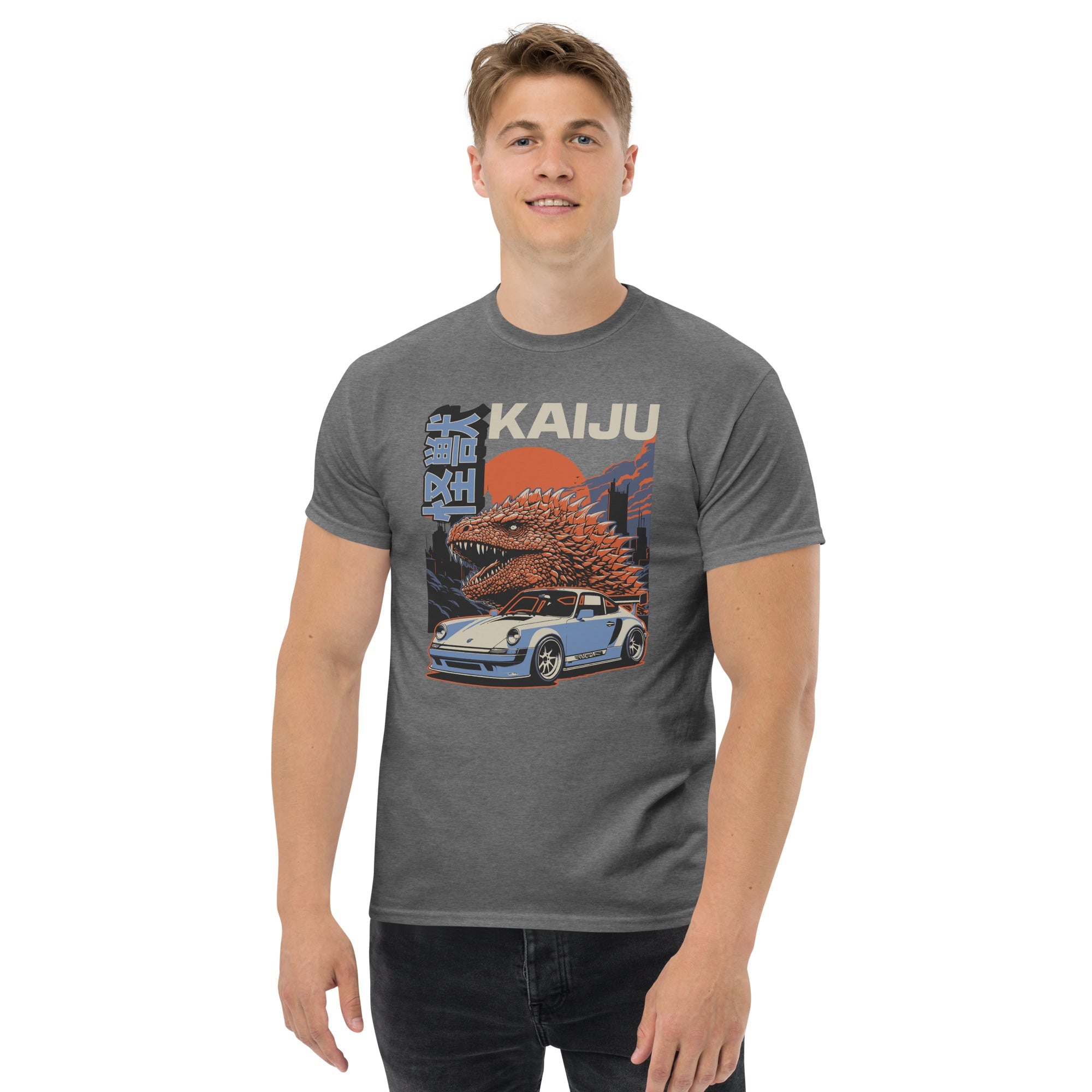 a man wearing a charcoal t-shirt with a monster kaiju and Porsche Car vintage Graphic design against a white background