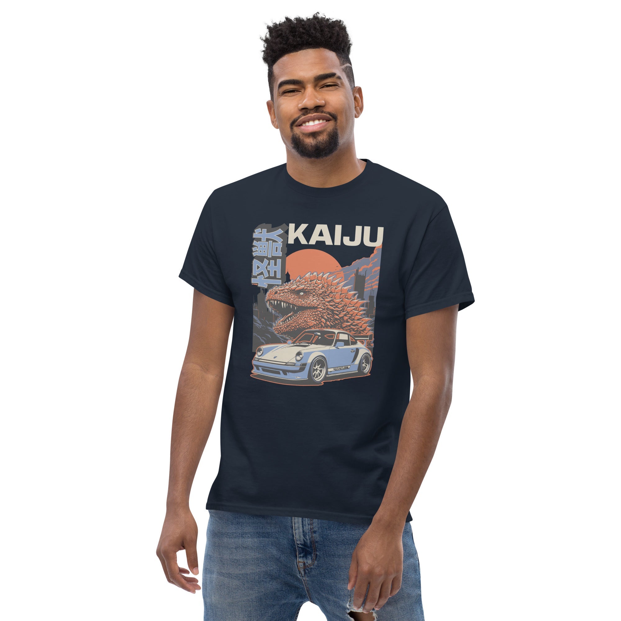 a man wearing a navy t-shirt with a monster kaiju and Porsche Car vintage Graphic design against a white background