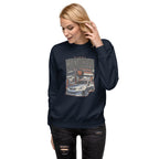 a woman wearing a navy sweatshirt with Vintage Night Wanderer Car graphic design on a white background