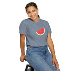 Person wearing a gray t-shirt with a watermelon design on a white background
