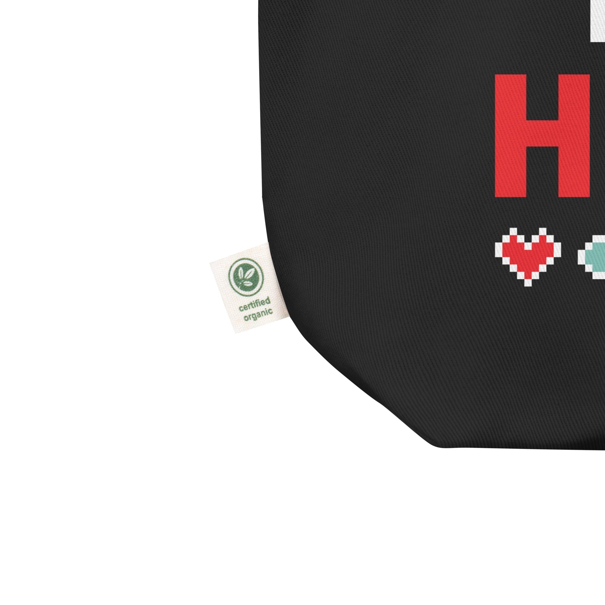 Black bag with red letter 'H' and pixelated hearts, featuring a certified organic label.