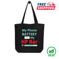 Black tote bag with humorous text design on a white background, featuring free shipping and eco-friendly icons.