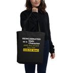Person holding a black tote bag with humorous text design.