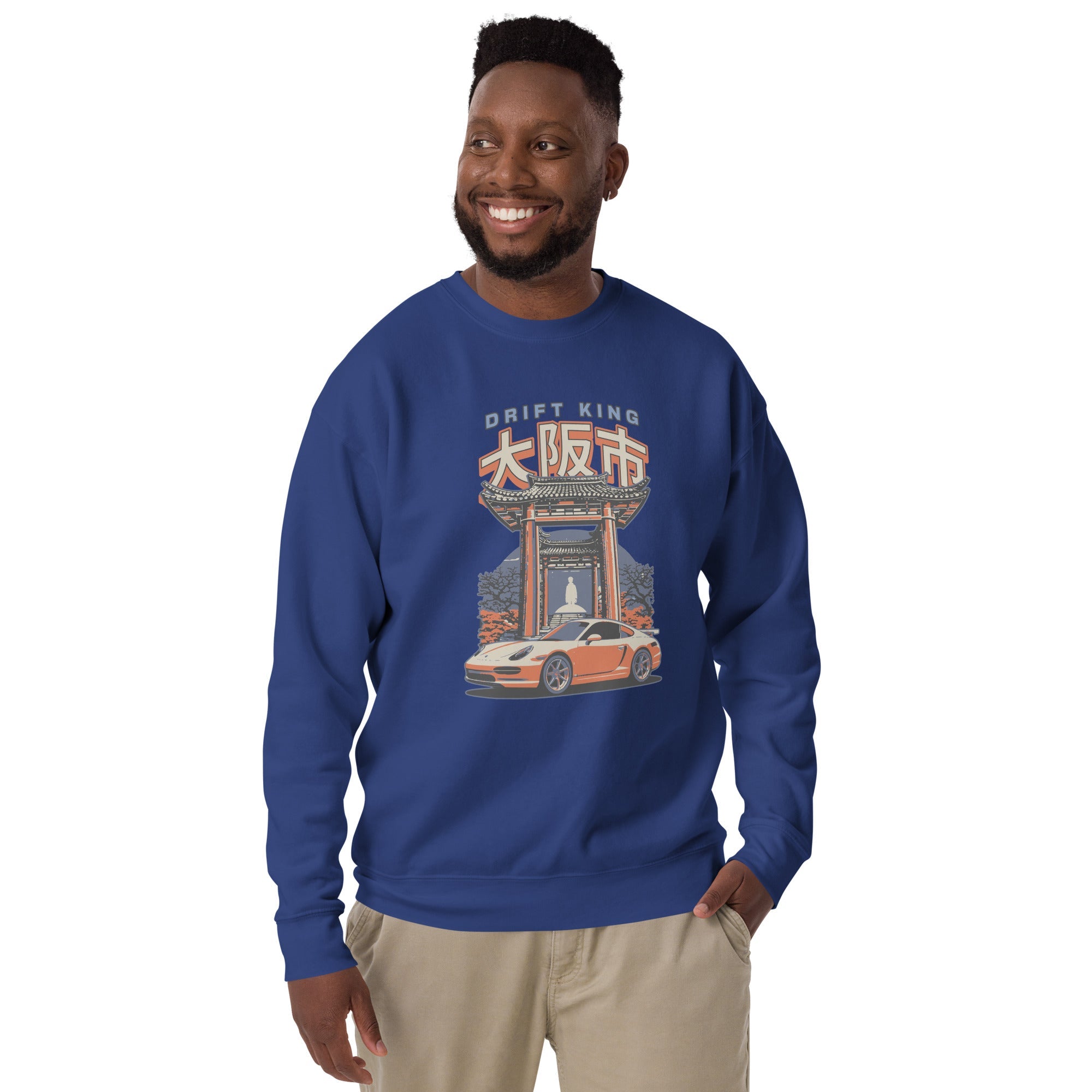 a man wearing a blue sweatshirt with a Drift King Japanese Porsche Car Graphic design against a white background