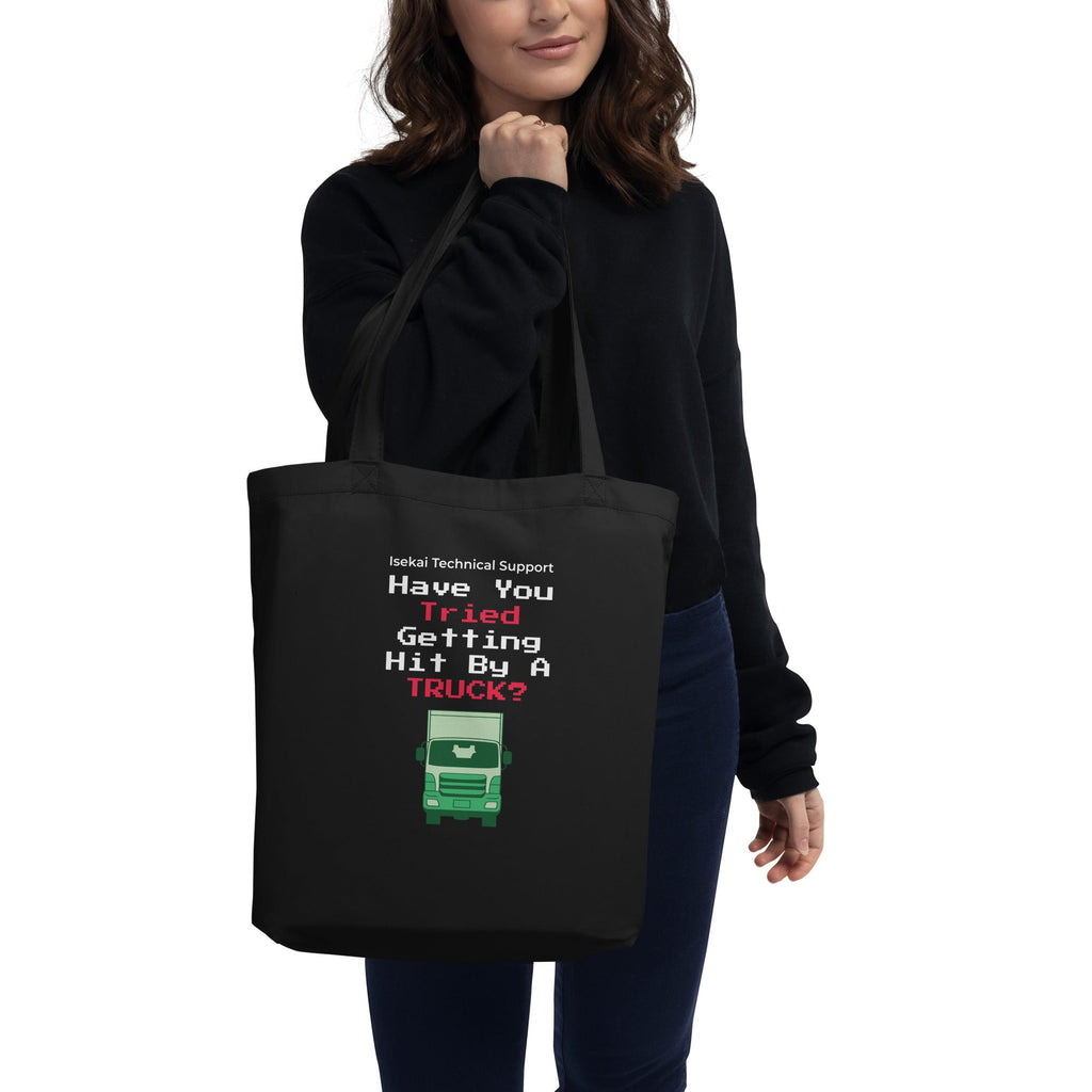 Person holding a black tote bag with humorous text design.