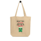 Beige tote bag with humorous truck graphic and text on a white background
