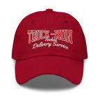 Red cap with 'TRUCK-KUN Isekai Delivery Service' text on a white background