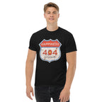 Person wearing a black t-shirt with a graphic design on a white background