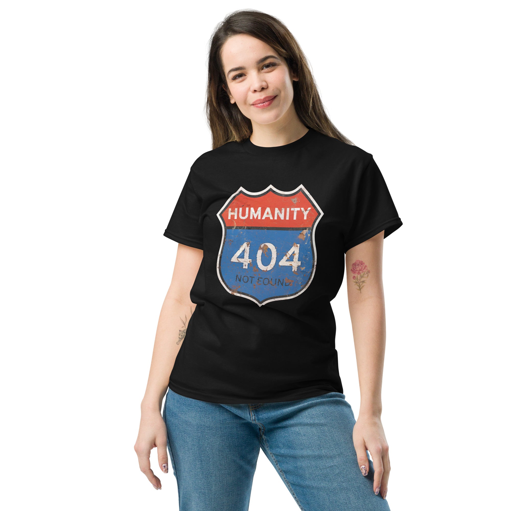 Person wearing a black t-shirt with a unique 'Humanity 404 Not Found'  design on a white background