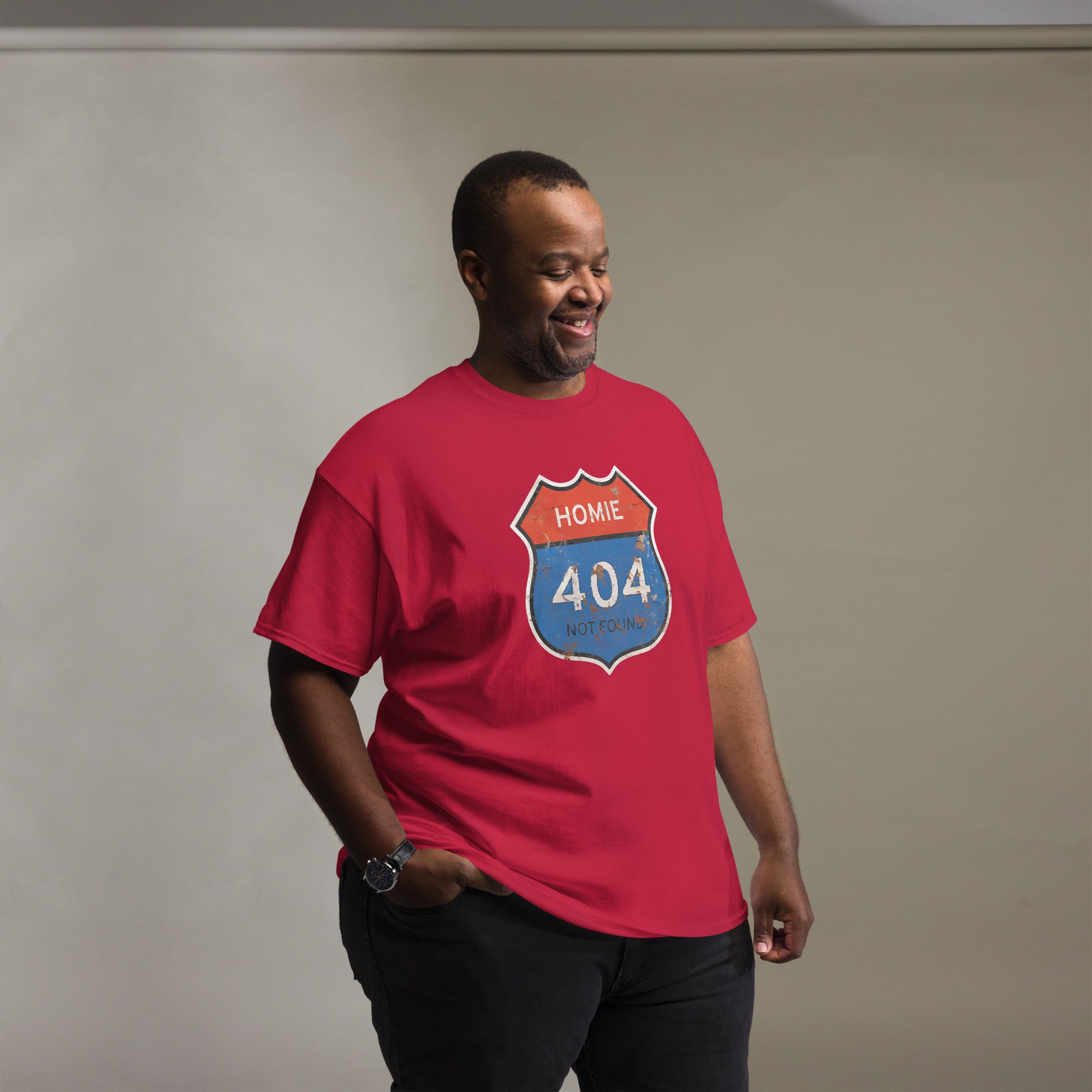 Man wearing a red t-shirt with a "Homie 404 Not Found" graphic design on a plain background