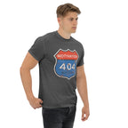 Man wearing a gray t-shirt with a 'Motivation 404 Not Found'graphic design on a white background