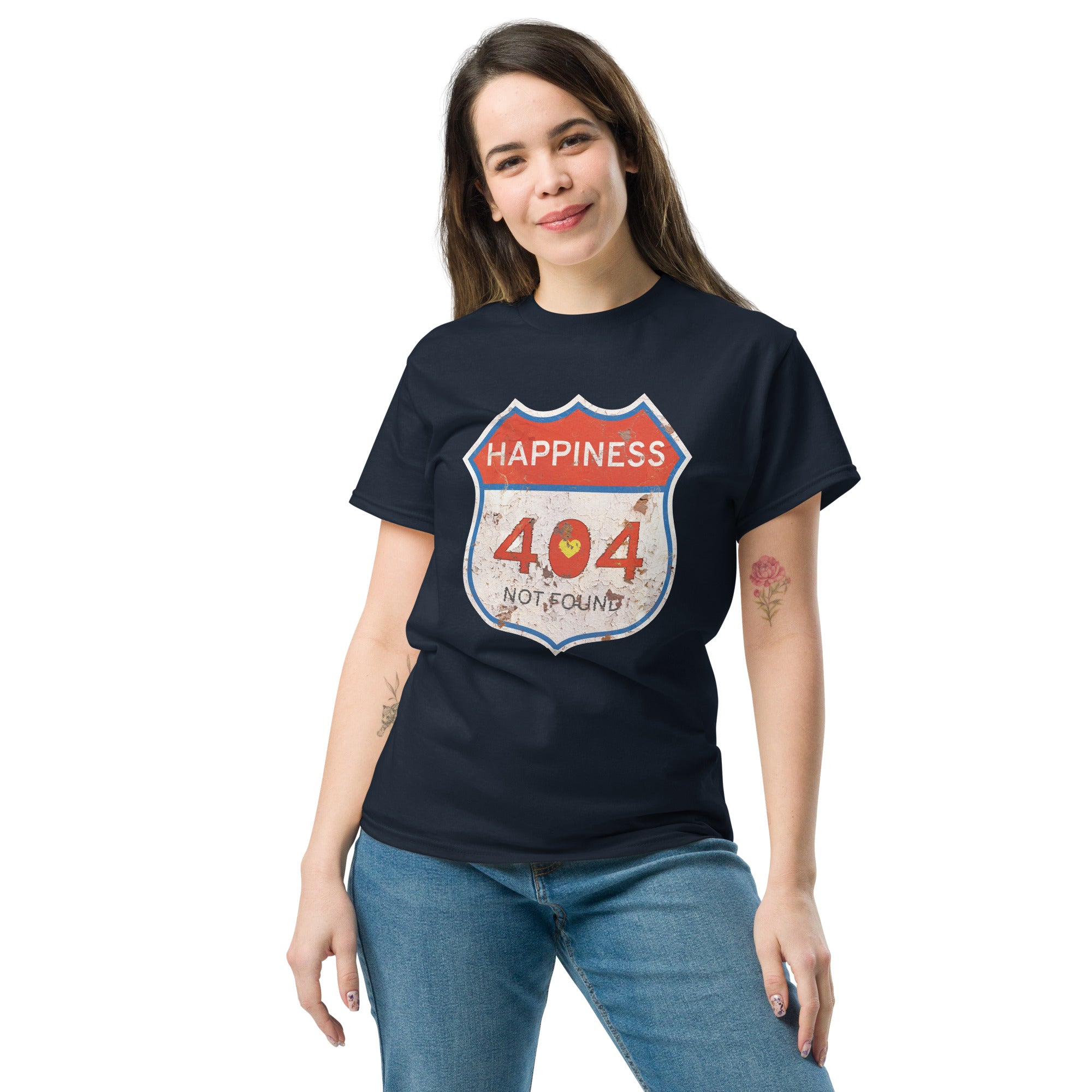 Person wearing a black t-shirt with a unique 'Happiness 404 Not Found' design on a white background