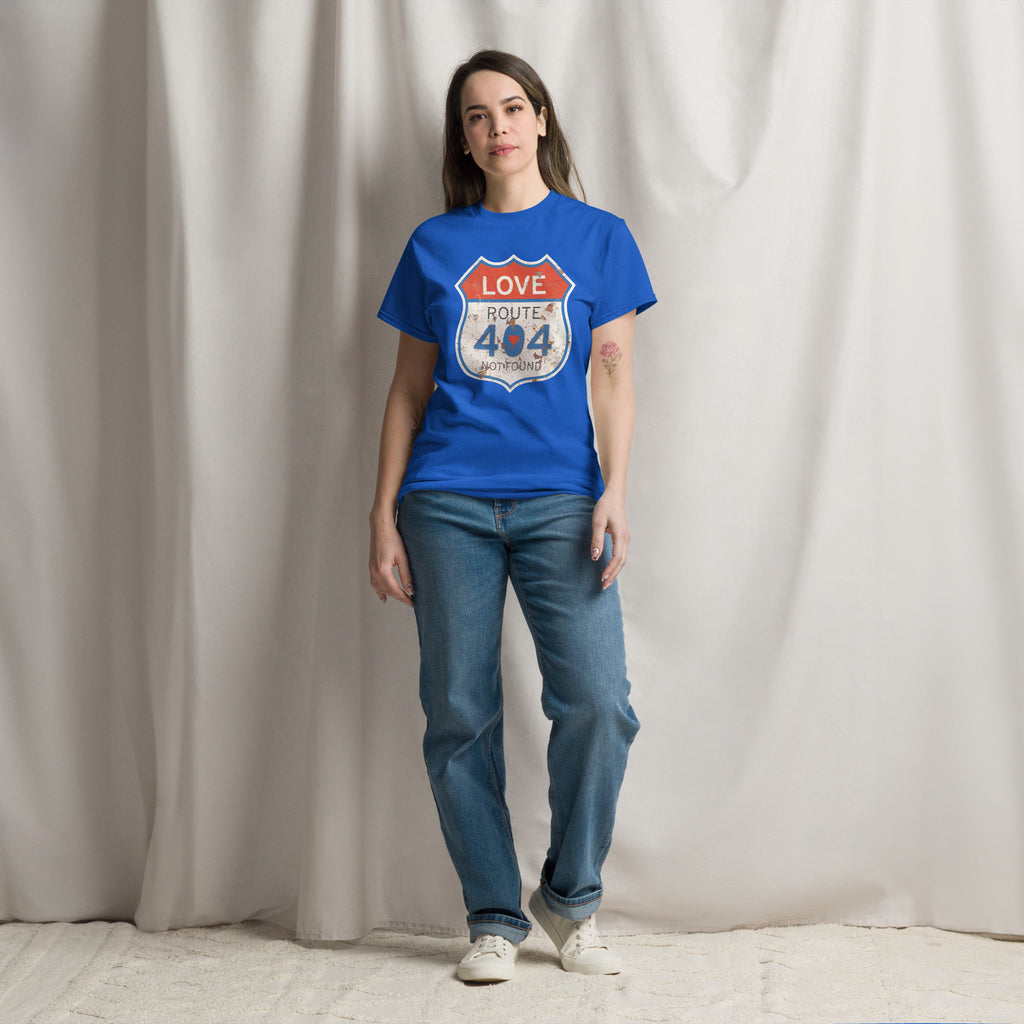 Person wearing a blue t-shirt with a graphic design against a plain background