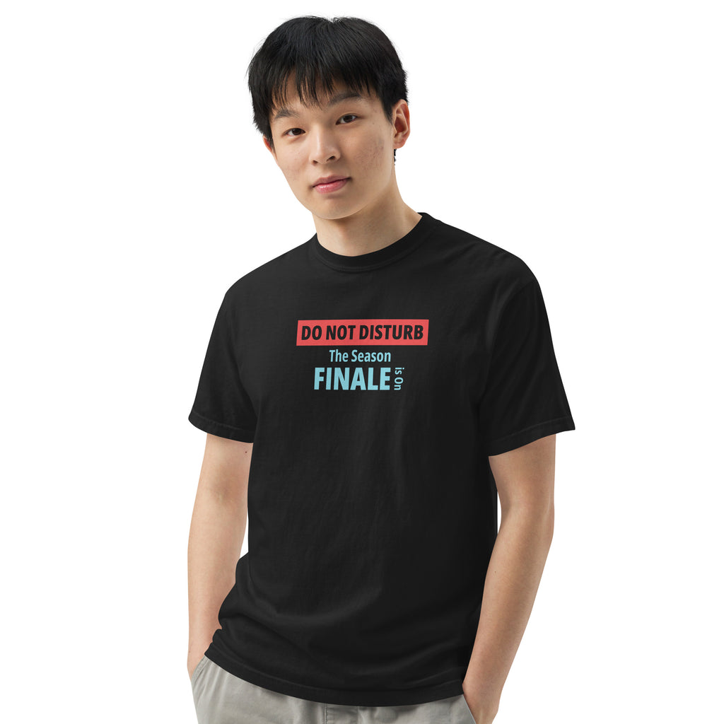 Person wearing a black t-shirt with text design 'DO NOT DISTURB The Season FINALE is On' on a white background