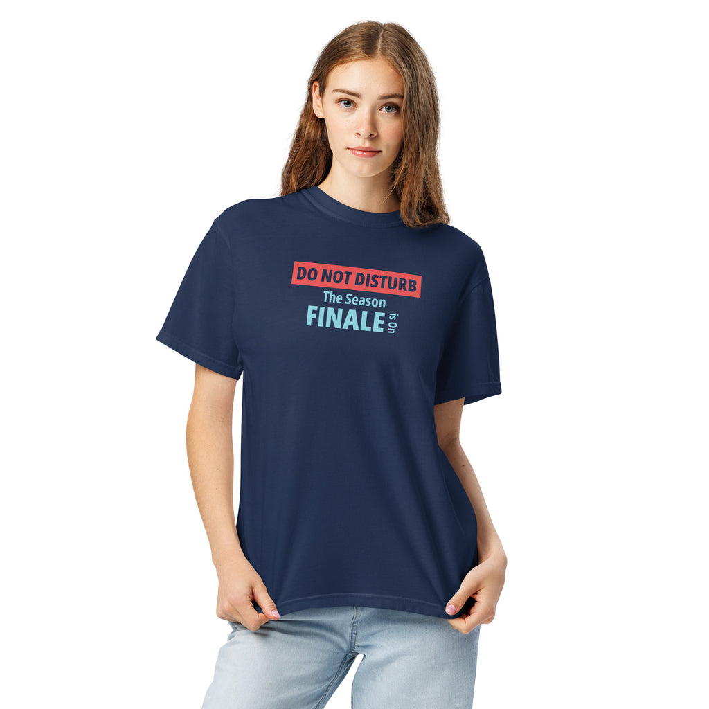 Person wearing a navy blue t-shirt with text design 'DO NOT DISTURB The Season FINALE is On' on a white background