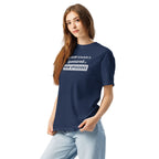 Person wearing a navy blue t-shirt with funny, witty 'My Sleep Schedule is Sponsored by New Episodes' text design on a white background