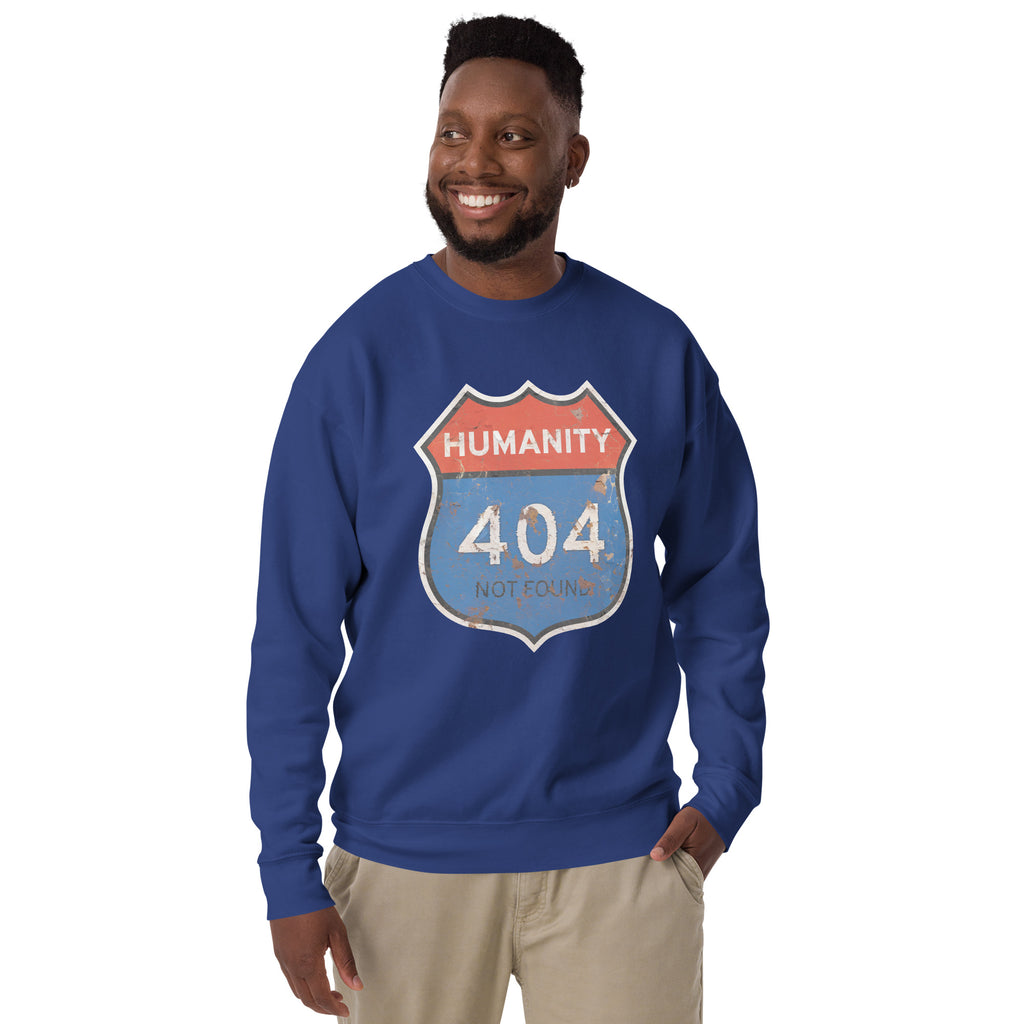 Man wearing a blue sweatshirt with a 'Humanity 404 Not Found' graphic design on a white background