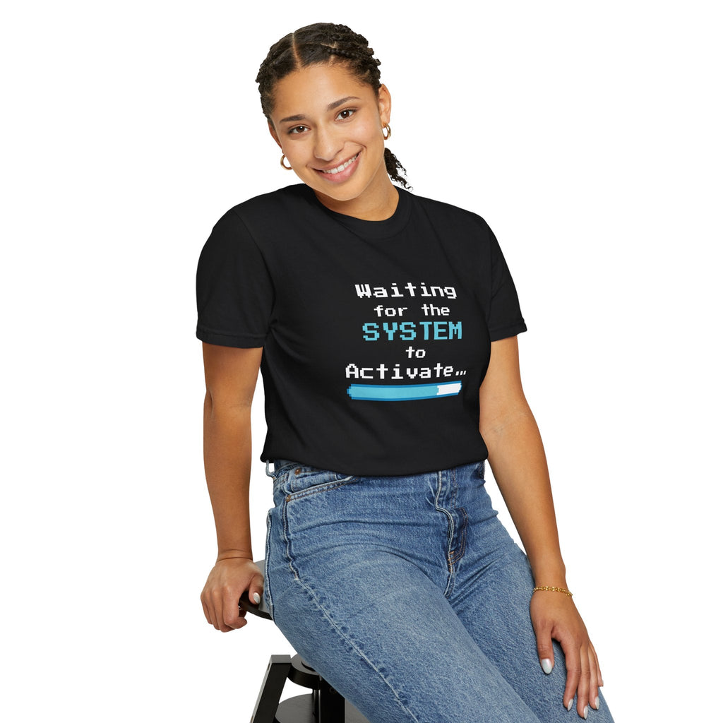Person wearing a black t-shirt with 'Waiting for the System to Activate' text and a loading bar graphic on a white background