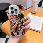 Phone case with a colorful anime Kimetsu No Yaiba Demon Slayer Yoriichi design held by a hand on a wooden table.